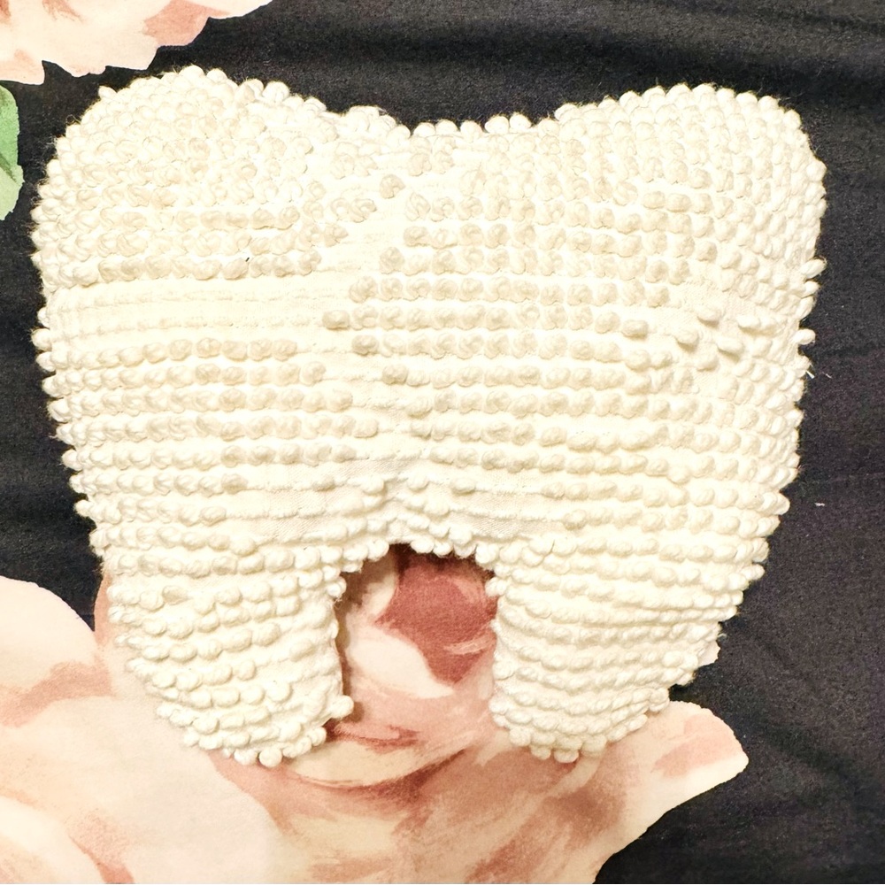 Tooth-shaped tooth fairy pillow with pocket for tooth.